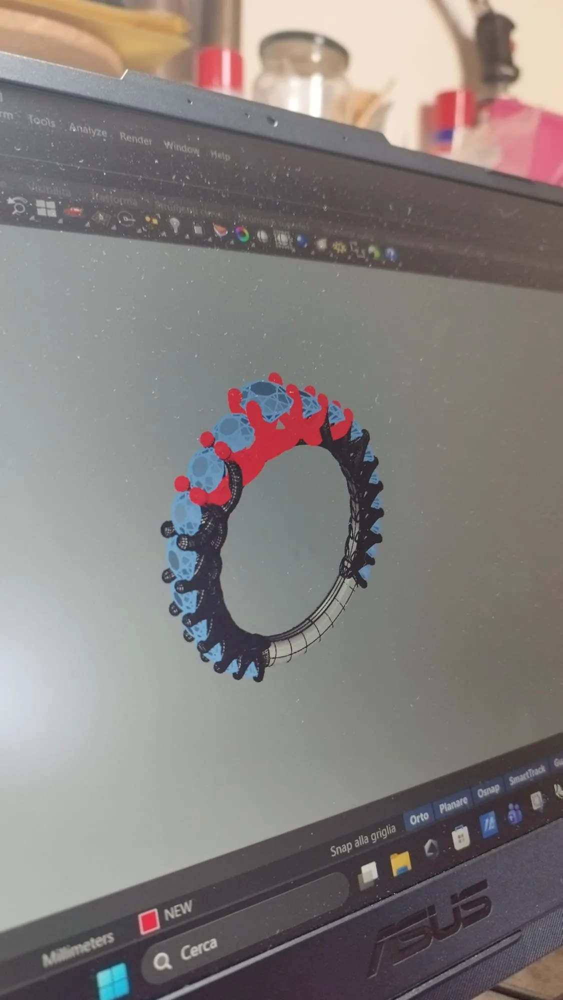 The eternity ring as a 3D model in Rhino, the prongs of one section highlighted in red
